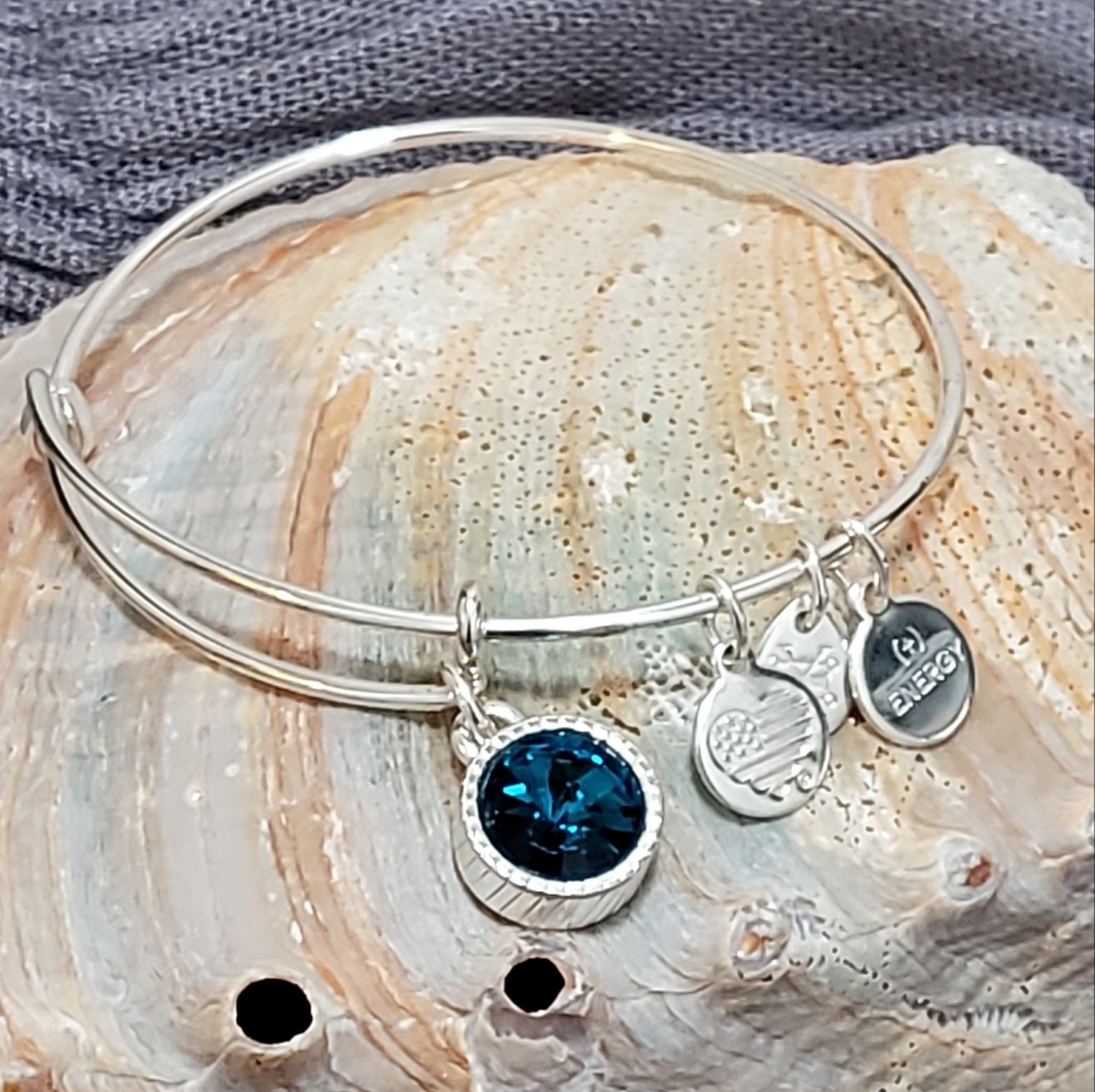Alex & Ani bracelet, shiny sliver. Blue zircon stone.